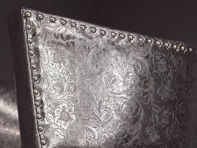 Damascato su poltrona in pelle